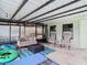 Outdoor patio with seating and covered area, great for entertaining at 12529 Shadow Ridge Blvd, Hudson, FL 34669