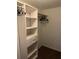 Spacious walk-in closet with built-in shelves and drawers at 12529 Shadow Ridge Blvd, Hudson, FL 34669