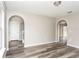 Dining room with hardwood floors and arched doorways at 1302 Dragon Head Dr, Valrico, FL 33594