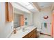 Bathroom with a vanity and bathtub at 13058 Santee St, Spring Hill, FL 34609