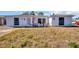 White single-story home with a spacious yard at 1333 Normandy Blvd, Holiday, FL 34691