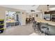Kitchen with island, stainless steel appliances, and view of the pool at 1333 Normandy Blvd, Holiday, FL 34691