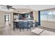 Kitchen with breakfast bar and dark wood cabinets at 1333 Normandy Blvd, Holiday, FL 34691