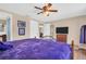 Spacious main bedroom with a large bed and pool view at 1333 Normandy Blvd, Holiday, FL 34691