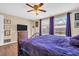 Main bedroom with a king-size bed and sliding doors to patio at 1333 Normandy Blvd, Holiday, FL 34691