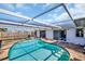 Refreshing kidney-shaped pool with covered patio at 1333 Normandy Blvd, Holiday, FL 34691