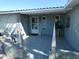 Covered front porch with tile flooring and stone accents at 13618 Stacey Dr, Hudson, FL 34667