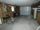 Unfinished garage with a workbench and various tools at 13618 Stacey Dr, Hudson, FL 34667