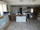 Kitchen needing renovation with exposed pipes and damaged walls at 13618 Stacey Dr, Hudson, FL 34667