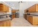 Kitchen with light wood cabinets, stainless steel appliances, and tile flooring at 14325 Highgrove Rd, Brooksville, FL 34609