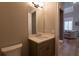 Modern bathroom with a single vanity and toilet at 18025 Nimick Rd, Weeki Wachee, FL 34614