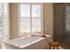 Modern bathroom featuring a freestanding soaking tub and walk-in shower at 18025 Nimick Rd, Weeki Wachee, FL 34614