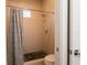 Shower with gray whale shower curtain and mosaic tile floor at 18025 Nimick Rd, Weeki Wachee, FL 34614