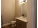 Clean bathroom with modern vanity and tile floors at 18025 Nimick Rd, Weeki Wachee, FL 34614