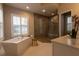 Spa-like bathroom with soaking tub, walk-in shower, and modern fixtures at 18025 Nimick Rd, Weeki Wachee, FL 34614