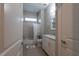 Clean bathroom with a bathtub, toilet, and white vanity at 18025 Nimick Rd, Weeki Wachee, FL 34614