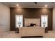 Spacious bedroom with large bed,accent wall and plantation shutters at 18025 Nimick Rd, Weeki Wachee, FL 34614
