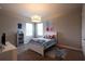 Charming bedroom with Frozen theme, featuring a white bed frame and carpet flooring at 18025 Nimick Rd, Weeki Wachee, FL 34614