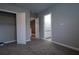 Well-lit bedroom with carpet flooring and access to a bathroom at 18025 Nimick Rd, Weeki Wachee, FL 34614
