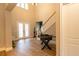 Spacious entryway with hardwood floors, stairs and foosball table at 18025 Nimick Rd, Weeki Wachee, FL 34614