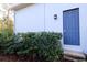 Exterior view of a home's exterior door and landscaping at 18025 Nimick Rd, Weeki Wachee, FL 34614
