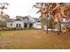 Two-story house with gray siding, white trim, and a three-car garage at 18025 Nimick Rd, Weeki Wachee, FL 34614