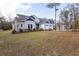 Two-story house on a large lot with mature trees at 18025 Nimick Rd, Weeki Wachee, FL 34614