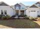 House with gray and white siding, double doors, and landscaping at 18025 Nimick Rd, Weeki Wachee, FL 34614