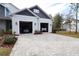 Two-car garage with paver driveway and ample parking space at 18025 Nimick Rd, Weeki Wachee, FL 34614
