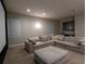 Comfortable home theater with sectional sofa and large projection screen at 18025 Nimick Rd, Weeki Wachee, FL 34614