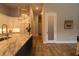 Kitchen with an island, granite countertops, and wood flooring at 18025 Nimick Rd, Weeki Wachee, FL 34614