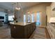 Open concept kitchen with large island and stainless steel appliances at 18025 Nimick Rd, Weeki Wachee, FL 34614
