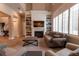 Two-story living room with built-in shelving and fireplace at 18025 Nimick Rd, Weeki Wachee, FL 34614