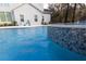 Luxury pool with unique pebble tile and spa at 18025 Nimick Rd, Weeki Wachee, FL 34614