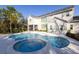 Stunning pool and spa with spacious patio and tranquil backyard view at 18025 Nimick Rd, Weeki Wachee, FL 34614