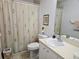 Bathroom with shower/tub combo and vanity at 18049 Tarrington Pl, Hudson, FL 34667