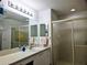 Clean bathroom with a large vanity and shower at 18049 Tarrington Pl, Hudson, FL 34667