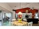 Dining area with a view of the living room and access to the kitchen at 18049 Tarrington Pl, Hudson, FL 34667