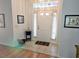 Bright entryway with tiled floor and access to the main living areas at 18049 Tarrington Pl, Hudson, FL 34667