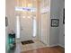 Bright entryway with tile floors and coat closet at 18049 Tarrington Pl, Hudson, FL 34667