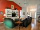 Living room with hardwood floors, fireplace, and built-in shelving at 18049 Tarrington Pl, Hudson, FL 34667