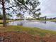 Serene pond with fountain in a peaceful community setting at 18049 Tarrington Pl, Hudson, FL 34667