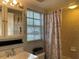 Clean bathroom with shower, vanity, and window at 21103 Patio View Ct # 3105, Lutz, FL 33558