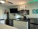 Bedroom with kitchenette, mini-fridge, and TV at 21103 Patio View Ct # 3105, Lutz, FL 33558