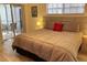 Main bedroom with king-size bed and access to patio at 21103 Patio View Ct # 3105, Lutz, FL 33558