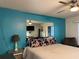 Bedroom with teal walls and a large mirror at 21103 Patio View Ct # 3105, Lutz, FL 33558