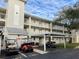 Two-story building with covered parking and golf cart spaces at 21103 Patio View Ct # 3105, Lutz, FL 33558
