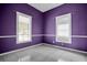 Spacious bedroom with tile floors and purple walls at 2221 Stuart St, Tampa, FL 33605