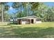 Rustic barn with stalls and fenced area, in a rural setting at 23051 Lake Lindsey Rd, Brooksville, FL 34601