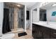 Bathroom with walk-in shower and double vanity at 23051 Lake Lindsey Rd, Brooksville, FL 34601
